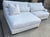 Sectional sofa, upholstered in stain-resistant Performance fabric. Cushions are filled with a down blend and feature...