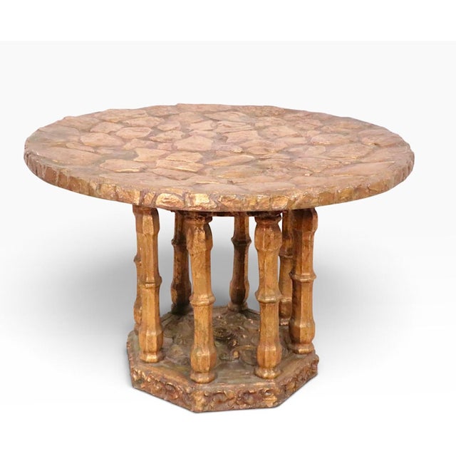 Unusual Brutalist, Spanish Colonial style side table having a dimensional textured top, which rests on the circular...