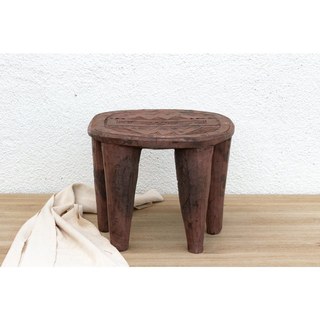 A unique piece of African art, this vintage Nupe table from Nigeria is a must-have for collectors and enthusiasts of Nupe...