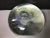 Signed art glass paperweight by renowned Ohio glass blower / artist, Robert Eickholt. Round clear form with an interior...