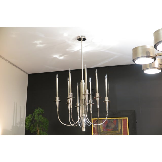 This Mid-Century modern chandelier exudes sophisticated elegance at first glance. The illusion of a circle although in...