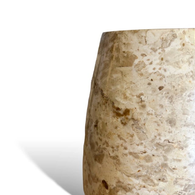 Elevate your space with the quiet luxury of natural stone. This tall vase is handcrafted from genuine marble, with soft...