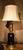 French 19th century oil lamp with a font in black glass held by all brass components Now wired for electricity as a lamp.
