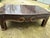 Black/dark brown cracked lacquered custom table with gilded details on the apron and the perimeter of the top. Possible...