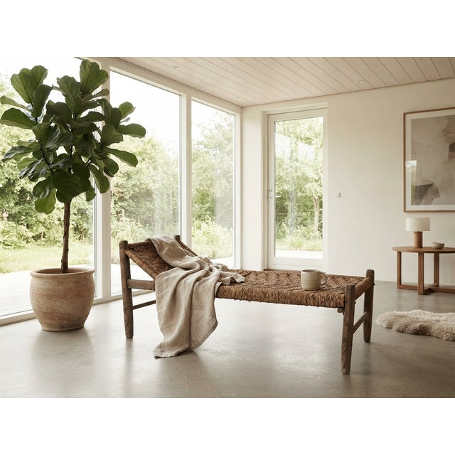 An authentic, primitive daybed featuring a beautifully weathered wooden frame and intricately hand-woven fiber seating....
