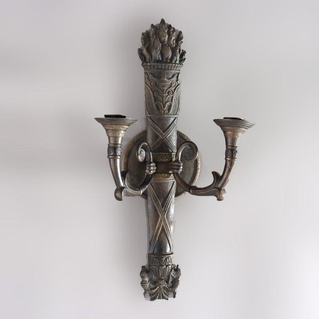 Antique Bronze Torch Form Two-Light Wall Sconce C1920. 16 7/8" x 8 3/4" x 5". This antique wall sconce, dating to circa...