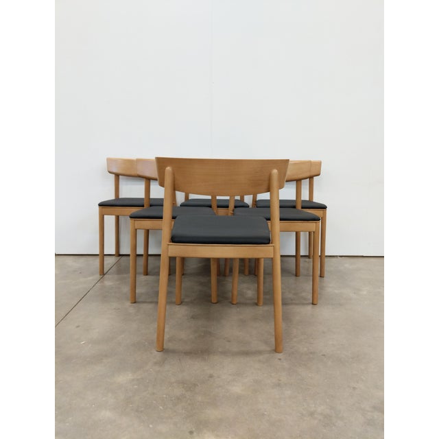 Set of 6 mid century style dining chairs in beech wood. Model "Smart SI0611" by Andreu World of Spain. Maker's label on...