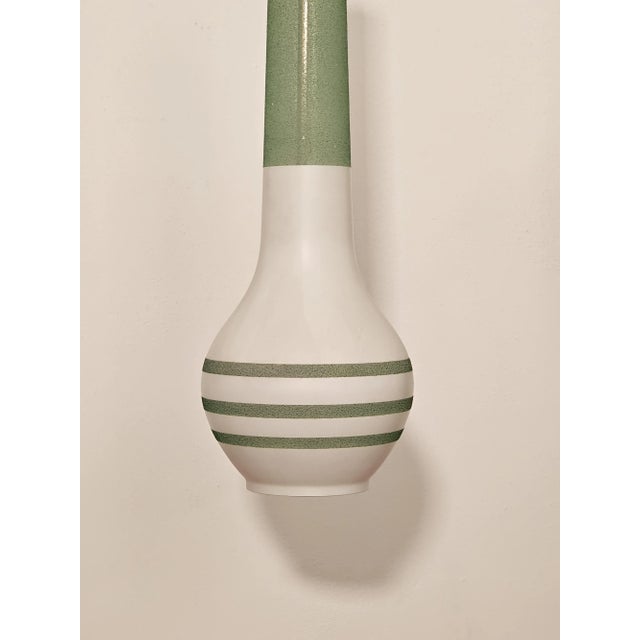 Murano glass pendant lamp dating back to the 1950s. Stunning green and opal white color. In perfect condition and fully...