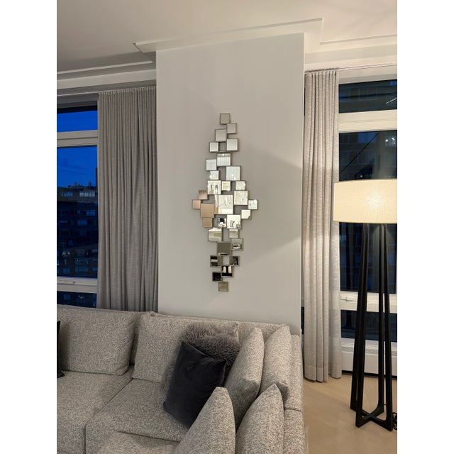 A work of modern art, this dramatic asymmetrical Christopher Guy mirror features square-shaped micro-beveled mirror panes...