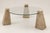 Travertine and glass coffee table. It features a glass top with some signs of wear, scratches, and a small chip that can...