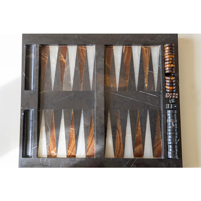 A striking example craftsmanship from the 1970s, this vintage backgammon set is masterfully constructed from richly veined...