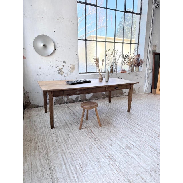 Antique solid oak farmhouse table from the 1950s. we love its typical farmhouse look, with its tapered legs, two drawers...