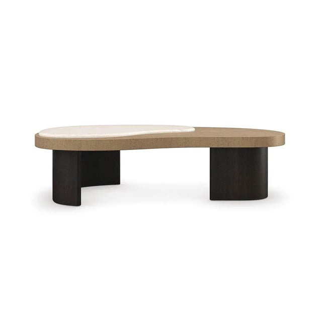 An artistic expression of modern elegance, this cocktail table adds interest and fluidity to living interiors. Its sleek...