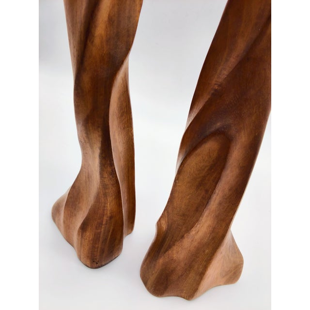 A rare Artist carved pair of sculptural teak or walnut wooden candle holders. They have an abstract design. 12" tall....