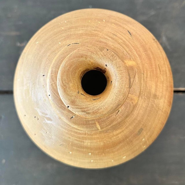 Bring rustic warmth and natural charm to your home with this Vintage Boho Distressed Turned Wood Vase. Crafted with care,...
