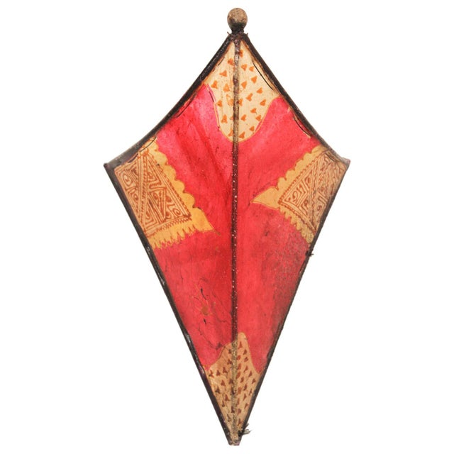 A striking vintage Moroccan Berber wall sconce shade, handcrafted in Marrakech, Morocco, circa 1980. This sculptural wall...