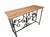Decorative vintage console / credenza table featuring a rectangular natural marble top resting on an elegant wrought iron...