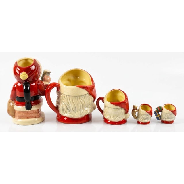 An extraordinary 5-piece collection of fine English bone china character and Toby jugs by Royal Doulton. This carefully...