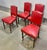 Antique set of four French red leather gaming chairs with antique brass nailhead decoration and trim. Carved and turned...