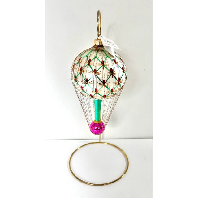 A rare Christopher Radko hot air balloon ornament, hand-blown glass with intricate wire detailing and jewel-tone accents....