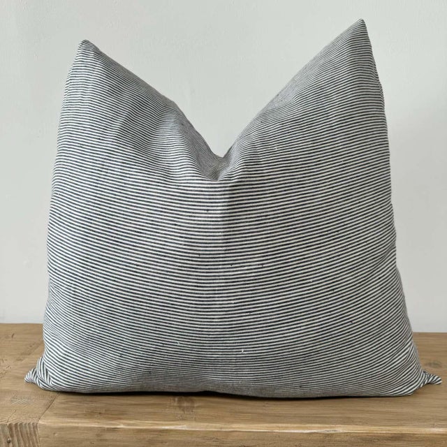 Libeco Home European ticking stripe pillow cover in navy and natural linen. Our pillows are constructed with the finest...