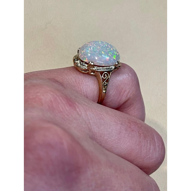 2010s 9 Carat Oval Shape Ethiopian Opal Cocktail Ring 14 Karat Yellow Gold For Sale - Image 5 of 18