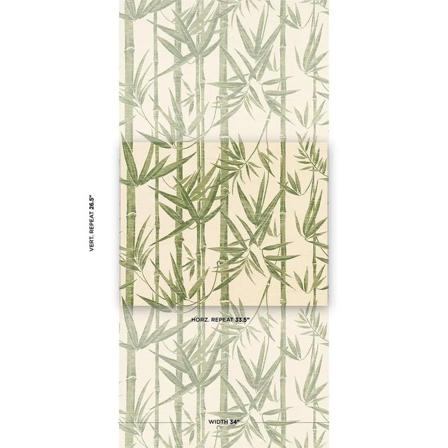 A silhouetted pattern of multiwidth bamboo stalks and overlapping foliage, Les Bambous Sisal in green-on-sand evokes the...