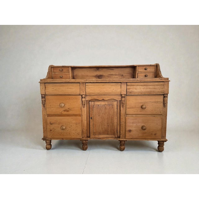 Beautiful antique 19th-century English pine buffet/sideboard, crafted in solid pine and retaining a warm, time-softened...