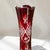 Elegant antique vase in ruby ​​red overlaid Bohemian glass, richly decorated with wheel cutting, circa 1950. Geometric...