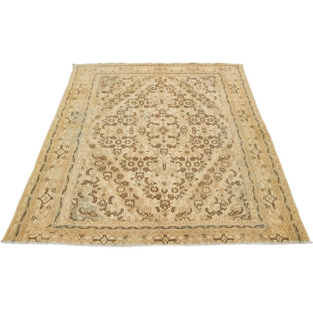 vintage hand-knotted Hamadan wool rug in a beautiful beige color with an all-over brown floral design. This rug measures...