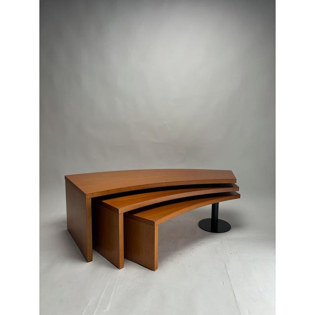 This coffee table embodies the bold aesthetic of 1980s Italian postmodern design through a functional nest-like structure....