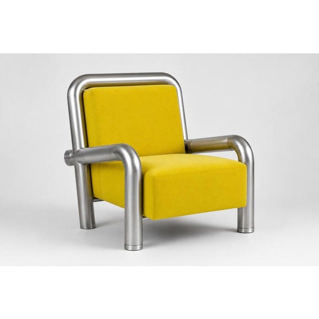 Tub armchair in wool and brushed steel by christophe perichon. Dimensions: w 110 x d 70 x h 80 cm. Materials: kvadrat wool...