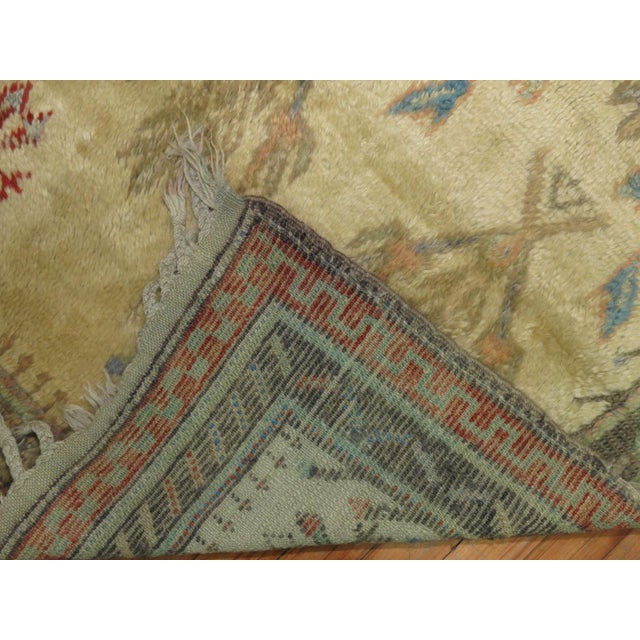 One of a kind Turkish Tulu rug with a repetitive branch design throughout on an ivory field, circa 1950s.