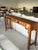 A striking 19th-century Chinese Altar table (Qiaotou'an), handcrafted from solid elmwood (Yumu) with a rich, naturally...