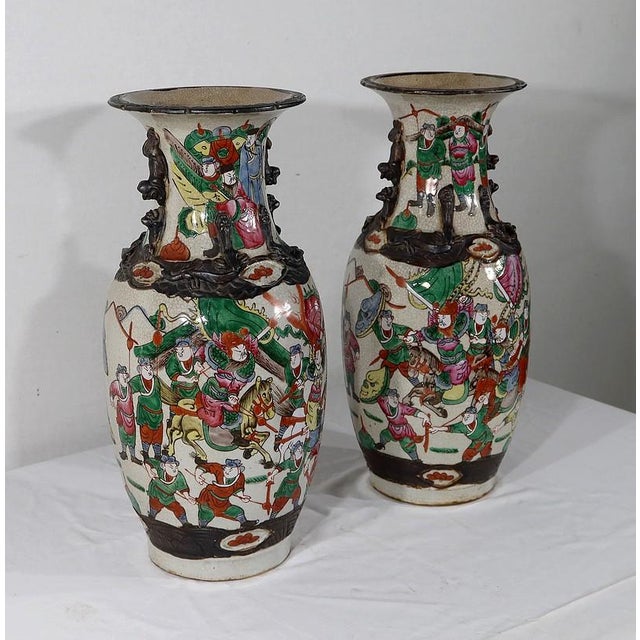 Pair of Chinese porcelain vases from Nankin, with beige cracked background with polychrome enameled decoration. Each vase...