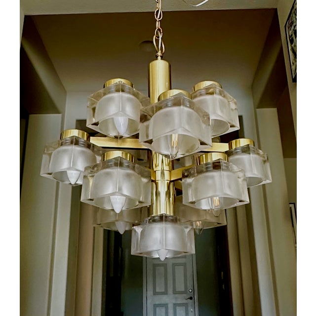 Mid-Century Modern 13 light "Ice Cube" chandelier designed by Gaetano Sciolari for Lightolier with frosted glass shades...
