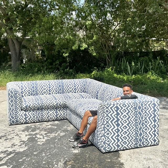 Make a bold and sophisticated statement with this incredible vintage custom sectional sofa, upholstered in the iconic...