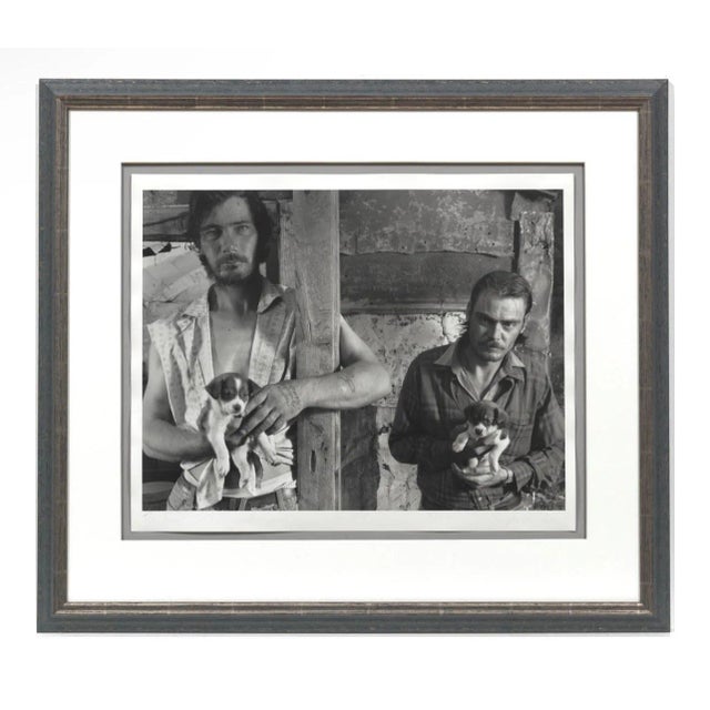 Shelby Lee Adams (American, b. 1950). The Napier brothers with Puppies Silver gelatin print, 25/25. Signed in pencil lower...