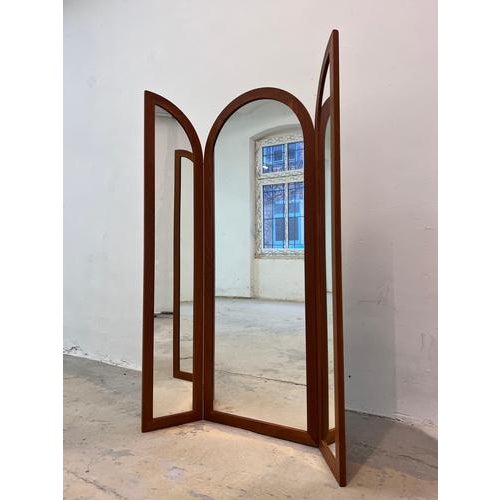 A particularly rare mid-century piece! An elegant, three-panel mirror from the Danish manufacturer Fakse Furniture. The...