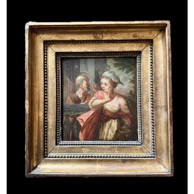"The Confidante" or "The Romantic Encounter," a charming small 18th-century oil on wood, French school. Later period frame...