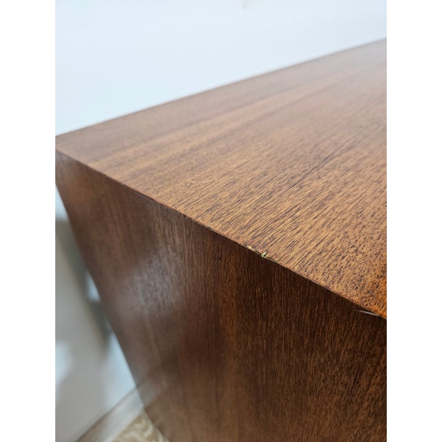 An authentic Mid-Century Modern long chest of drawers, providing the quintessence of 1960s Scandinavian design. The...