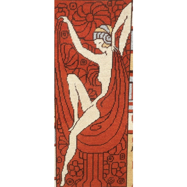 1970’s art nouveau revival needlepoint of a graceful nude lady in the manner of Alphonse Mucha or Erte. The piece is...