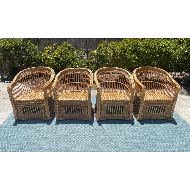 Gorgeous coastal style set of vintage wicker armchairs by luxury brand McGuire of San Francisco. These beautiful woven...