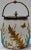 We are offering you a unique biscuit jar featuring raised turquoise Crow claws amongst gold leaves on white porcelain. The...