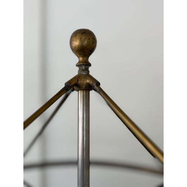 Handsome well made Iron clothes rack, on wheels. Cast iron base, with lovely details, iron central pole, with removable...