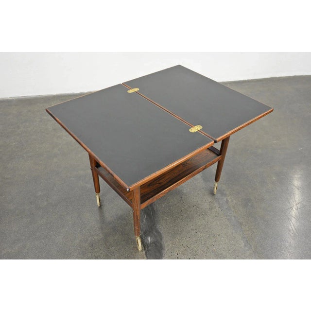 Origin: Denmark Designer: Grete Jalk Manufacturer: P. Jeppesen Era: 1960s Dimensions: 18″ wide (35.5″ when expanded) x 28″...