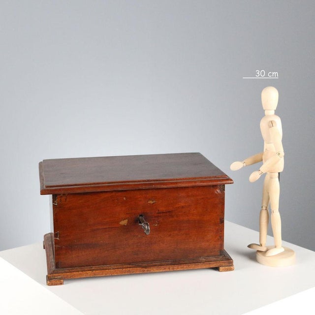 Walnut casket. Working lock with contemporary key. This piece is attributed to the mentioned designer/maker. It has no...