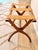 Elegant vintage folding luggage rack or valet stand crafted in richly toned wood with sculptural X-form legs and three...