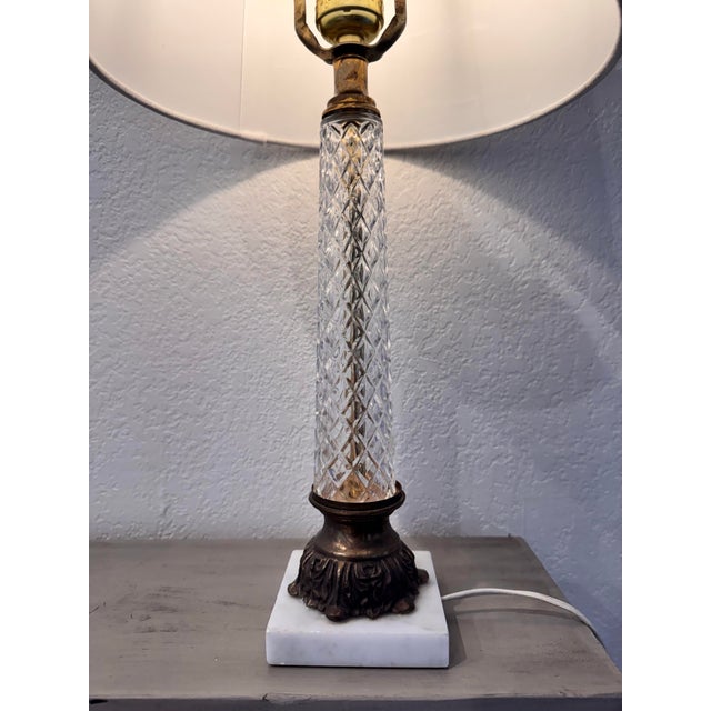 Elevate your space with this striking mid-century table lamp, beautifully channeling classic Neoclassical elegance with a...