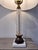 Elevate your space with this striking mid-century table lamp, beautifully channeling classic Neoclassical elegance with a...